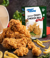 Crispy chicken pieces with Crust & Crumbs instant crispy chicken mix- Mexican special packaging on a dark surface.